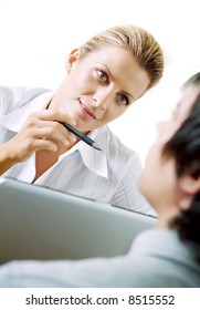 Female Adviser In Deep Conversation With Client