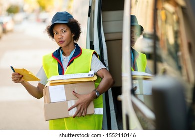 Happy African American Delivery Woman Delivering Stock Photo (Edit Now ...