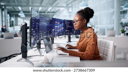 Female African Developer Creating Web Software On Office Computer Screen