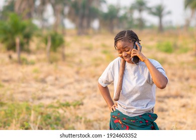 Female African Farmer Making A Phone Call