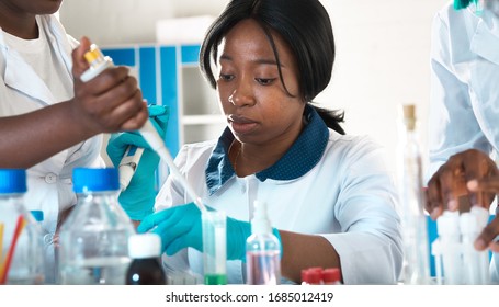 Female African Medical Students, Young Graduates In Research Laboratory Or Medical Test Lab Perform Various Testing On Samples. Nucleic Acid Dna Amplification Pcr Test For Corona Virus.