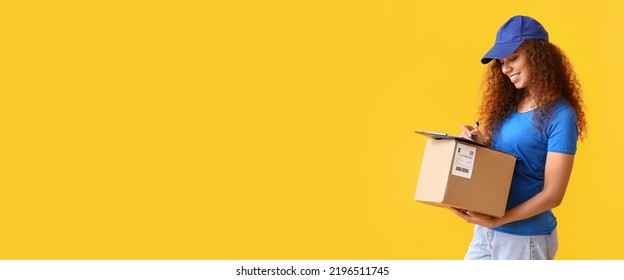 Female African-American courier with parcel on yellow background with space for text - Shutterstock ID 2196511745