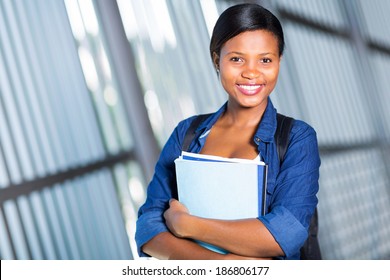 Female Afro American University Student Holding Books