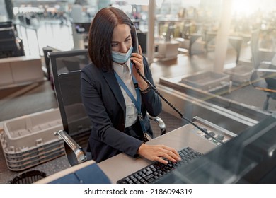 Female Airport Employee In Mask Taking On The Phone