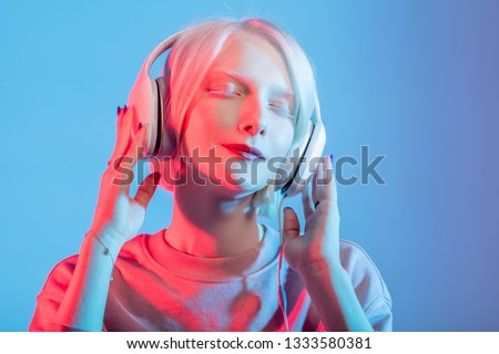 Similar – Young DJ woman in a night party