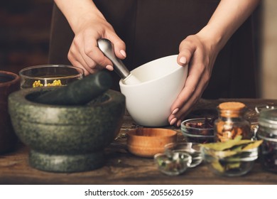 Female alchemist making elixir in laboratory - Shutterstock ID 2055626159