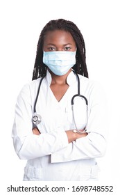 Female American African Doctor, Nurse Woman Wearing Medical Coat With Stethoscope And Mask. Happy Excited For Success Medical Worker Posing On Light Background. Pandemia Concept, Covid 19