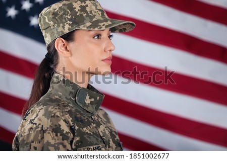 Female American soldier with flag of USA on background, space for text. Military service