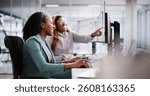 Female Analyst Using Multiple Screens for Business Data Analysis