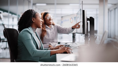 Female Analyst Using Multiple Screens for Business Data Analysis