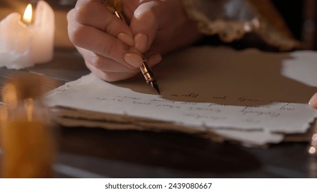 Female in antique outfit writes with feather pen. Close up shot of woman writing a letter with vintage quill on old parchment paper. - Powered by Shutterstock