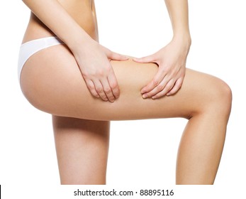 Female Applying Cosmetic Cream From Cellulite On Leg - Isolated On White