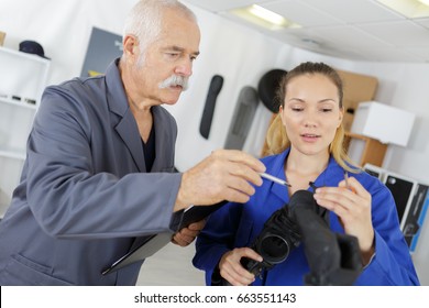 female apprentice learning about an engine - Powered by Shutterstock