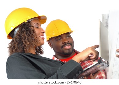 Female Architect And Construction Worker Looking At Laptop Together