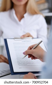 Female Arm In White Shirt Offer Contract Form On Clipboard Pad And Silver Pen To Sign Closeup. Strike A Bargain For Profit, White Collar Motivation, Union Decision, Corporate Sale, Insurance Agent