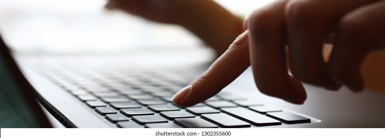 Female arms hold credit card press buttons making transfer closeup. Anti-fraud financial security when entering client discount program number or filling personal credential password login to account - Shutterstock ID 1302355600