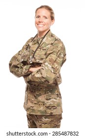 Female Army Doctor Or Nurse In Uniform On White Background.  Female US Soldier In The Medical Field Smiling.