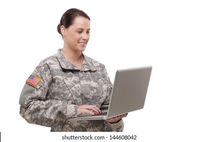 Female Army Soldier Working On A Laptop 