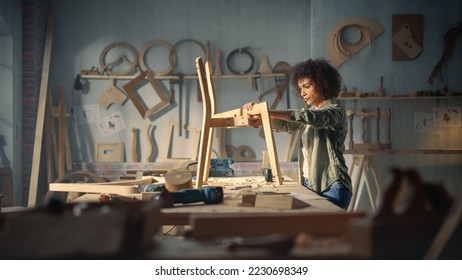 Female Artisan Furniture Designer Marking Out Dimensions on a Blueprint and Starting to Assemble a Wooden Chair. Multiethnic Black Carpenter Working in a Studio