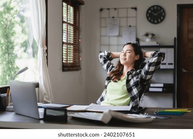 Female artist designer holding hands behind head and sleep to resting after working graphic design. - Powered by Shutterstock