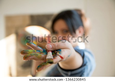 Similar – Baby Mädchen spielt mit Haarspangen, die auf dem Boden sitzen.