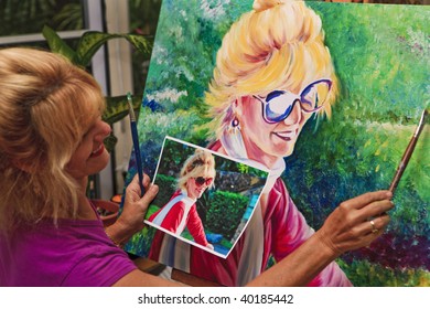 Female Artist Painting A Self Portrait