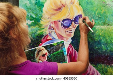 Female Artist Painting A Self Portrait