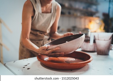 Female artist Working in Clay Studio Glazes Big Plate, Creative Art Pottery Handmade Concept Ceramic Studio Workshop - Powered by Shutterstock