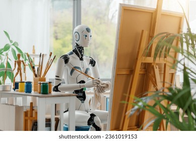 Female artistic AI robot in the art studio, she is painting on canvas and cleaning the paintbrush, creativity and artificial intelligence concept - Powered by Shutterstock