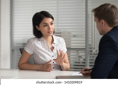Female asian bank manager insurer job applicant talk to male hr consult customer at interview meeting, japanese broker explain deal benefits to client make offer, recruit and business advice concept - Shutterstock ID 1410209819