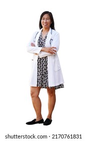 Female Asian Doctor Wearing White Lab Coat Over A Black And White Dress And Stethoscope Stands For A Full Body Portrait Against An Isolated White Background, Smiling With Arms Crossed