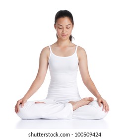 Female Asian Teenager Doing Meditation Against White Background