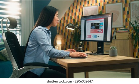 Female asian web designer using personal computer for creating website in professional constructor while working on project remotely at home. Freelance - Shutterstock ID 2206382647