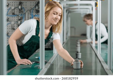 Female Assembly Line Workers On Production Hall