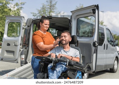 Female assistant helping a man in a wheelchair to use a smartphone. Disability and daily activity concepts. - Powered by Shutterstock