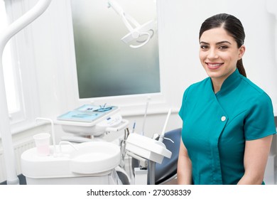 Female Assistant Posing In Dental Office