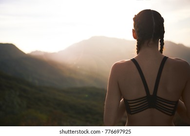 Female Athelete Overlooking Sunset