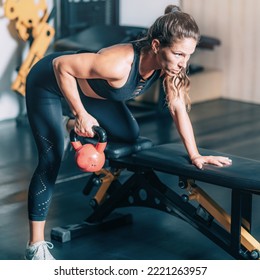 Female Athlete Exercising with Kettlebell. - Powered by Shutterstock