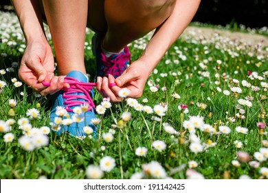 Female Athlete Getting Ready For Running In Spring Park. Fitness Workout Outdoor Concept.