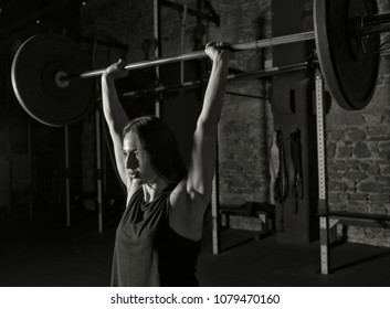 Female Athlete Practicing Clean And Jerk Movement