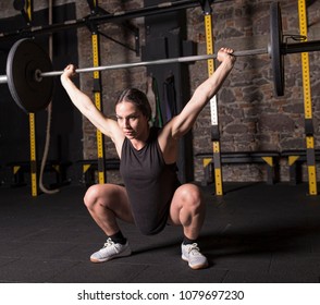 Female Athlete Practicing Snatch Movement