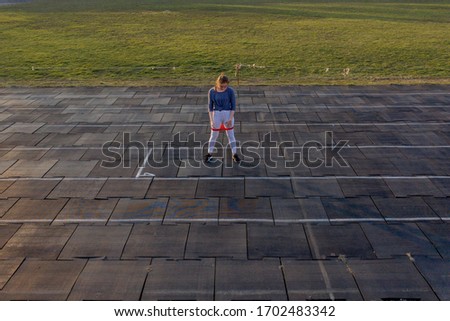 Similar – Senior sportswoman with headphones running