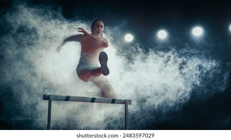 Female Athlete Runner Jumping Over Hurdle Amidst Dramatic Smoke and Bright Lights, Intense Focus, Agility, and Strength in High-energy Track and Field Event. - Powered by Shutterstock