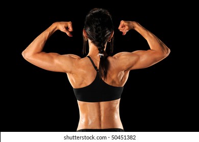 Female Athlete Showing Back Isolated Over Black Background