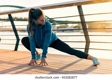 Female Athlete Streching Outdoors