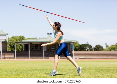 Female athlete throwing a javelin - Powered by Shutterstock