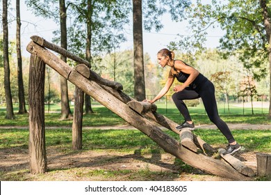 Female Athlete Training On Obstacle Course