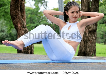 Female athlete warming up  before running, woman in sport athlete stretching on body before starting exercise