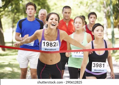 Female Athlete Winning Marathon Race