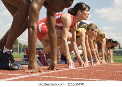 Female Athletes At Starting Line On Race Track